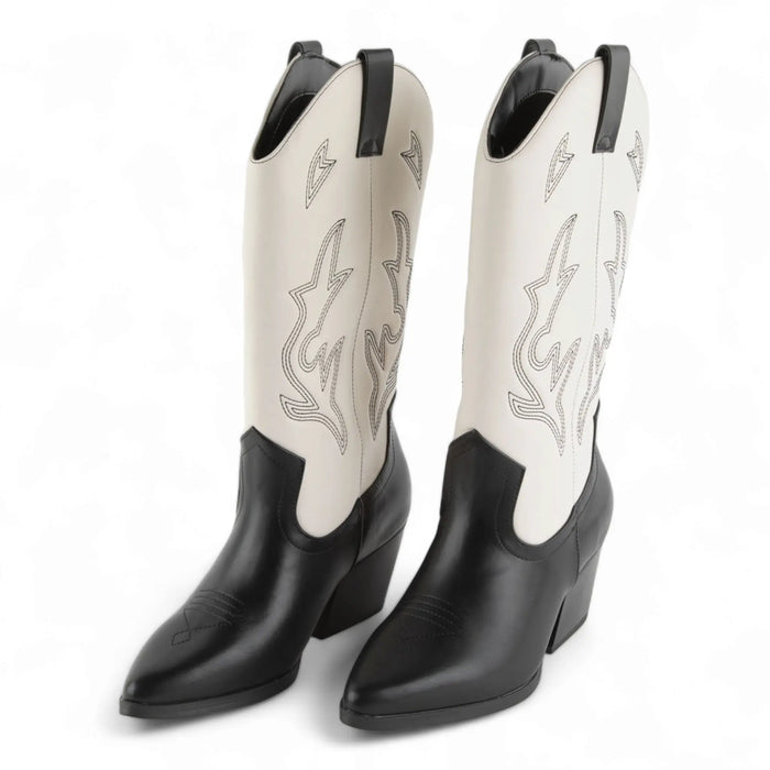 Black and white cowboy boots with pointed toes, decorative stitching, perfect for Wild West style