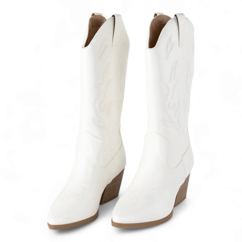 White knee-high cowboy boots with pointed toes and chunky heels for Wild West style