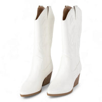 White knee-high cowboy boots with pointed toes and chunky heels for Wild West style