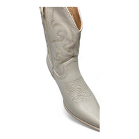 White leather cowboy boot with decorative stitching from Willa Wonka