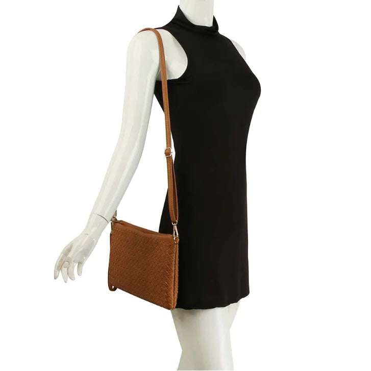 Black sleeveless turtleneck dress with a Woven Clutch Crossbody Bag for stylish outfits