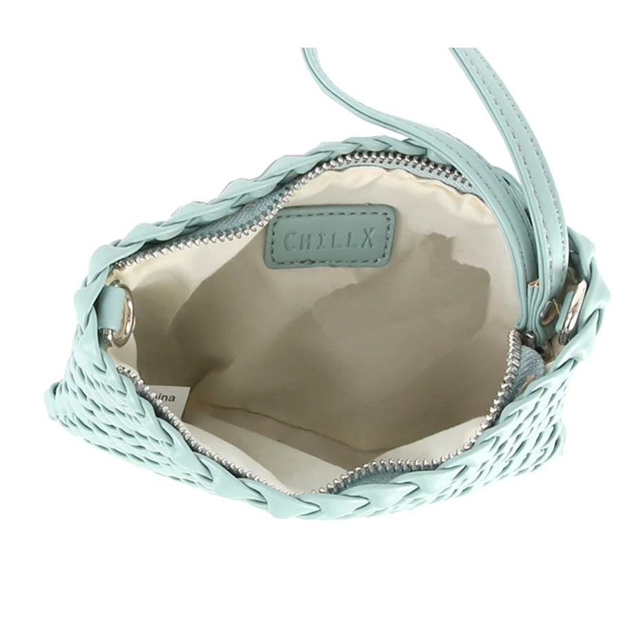 Mint green woven leather handbag, open top showcasing interior of the Woven Clutch Crossbody