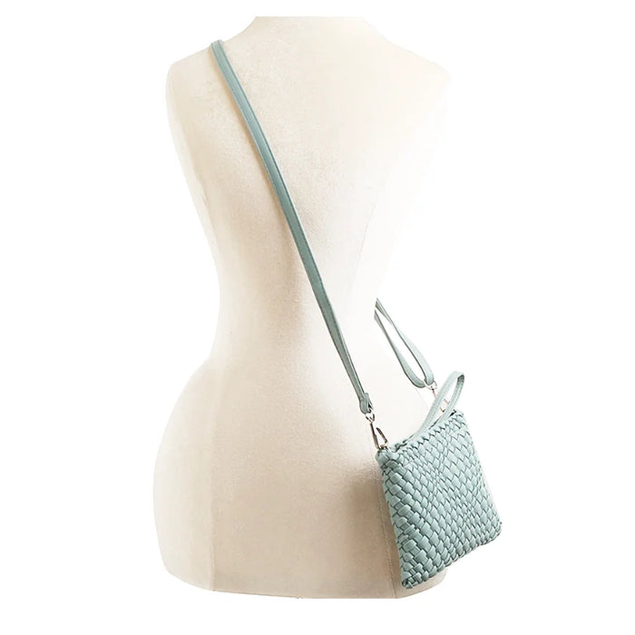 Pale blue woven clutch crossbody bag with a thin strap for stylish versatility