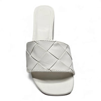 White leather slide sandal with woven upper design and low block heel for stylish comfort