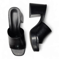 Pair of black leather high-heeled mule sandals for retro platform heels fashion